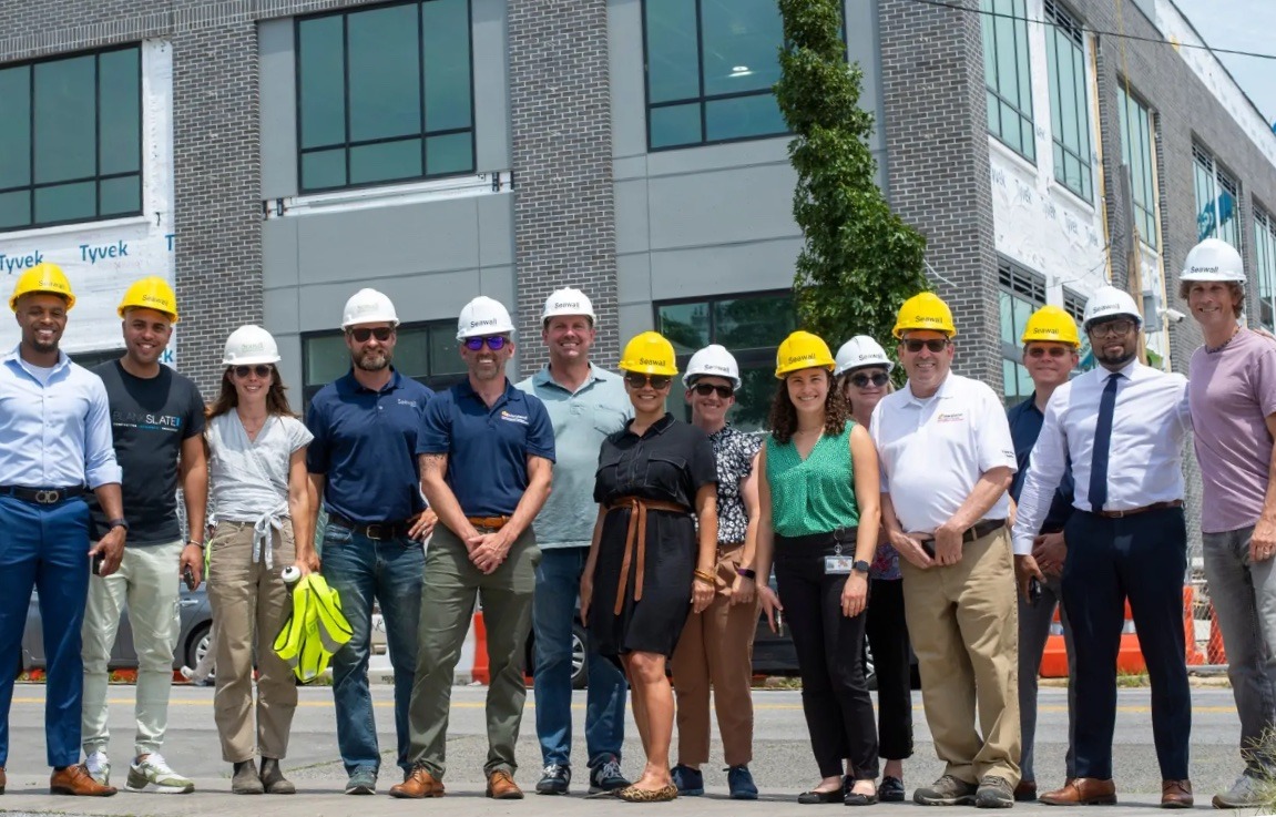 Members of Maryland’s Department of Housing and Community Development leadership team, including Cat Goughnour (center),
tour Baltimore projects with with Seawall Development.