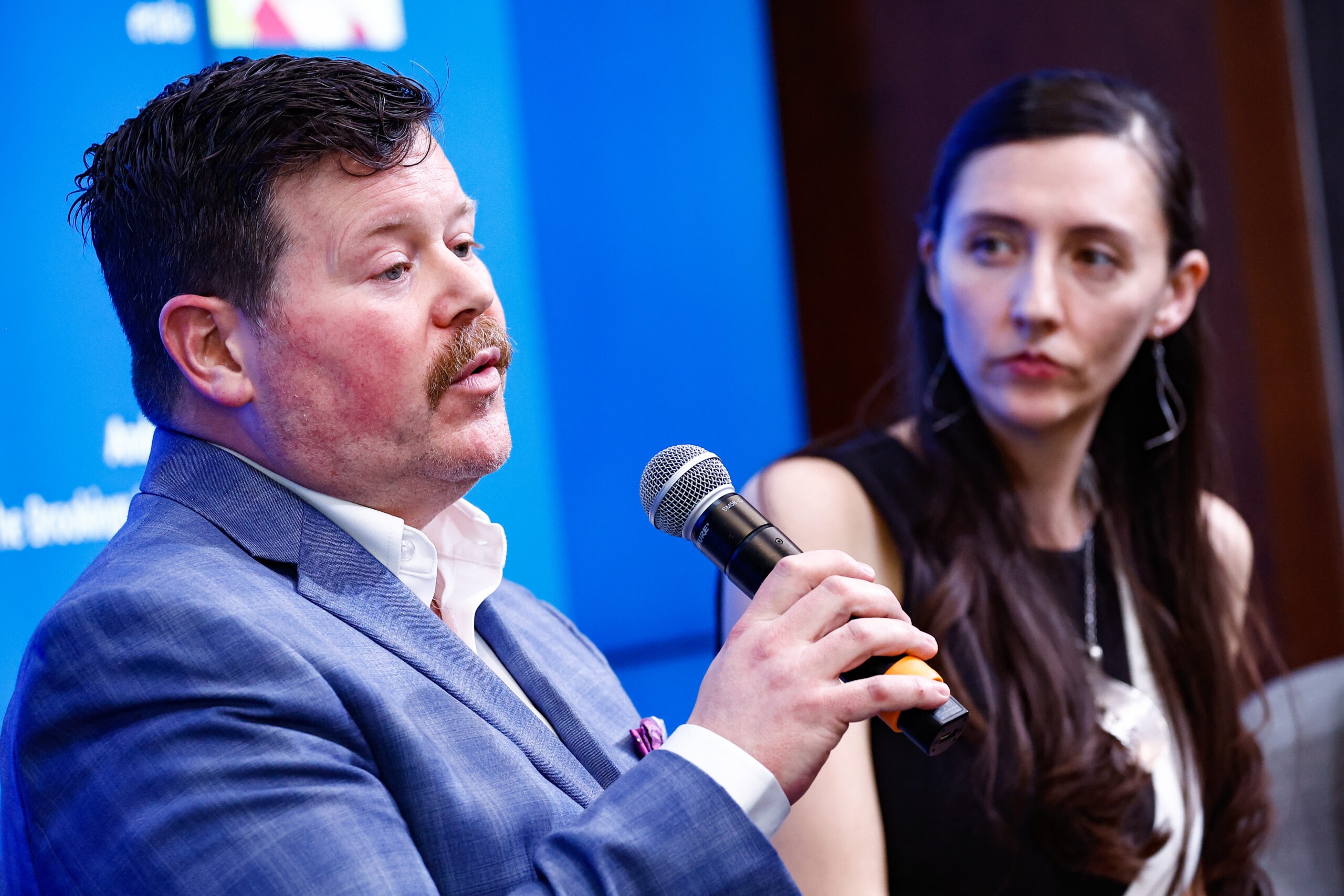 Spotlight Innovator Gabe Ewing del Rio speaking on stage in the Valuing Homes in Black Communities Panel at The Brookings Institution. 